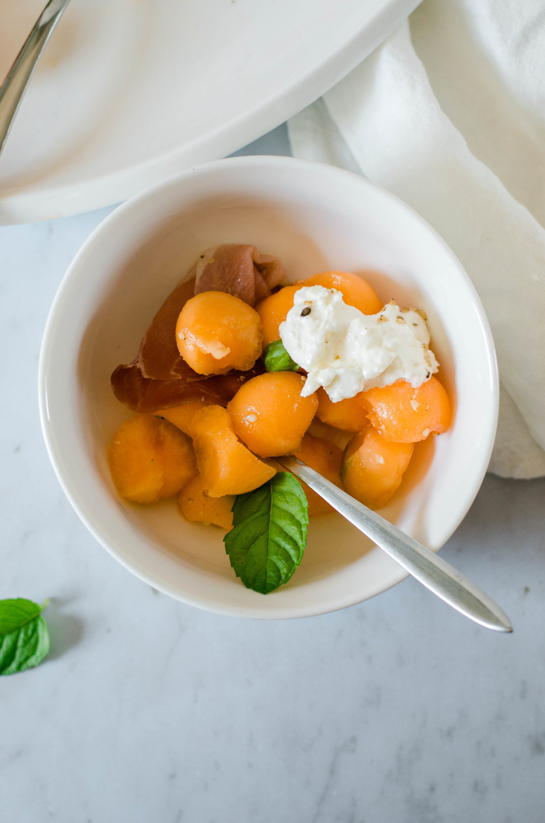 Salade melon burrata jambon cru