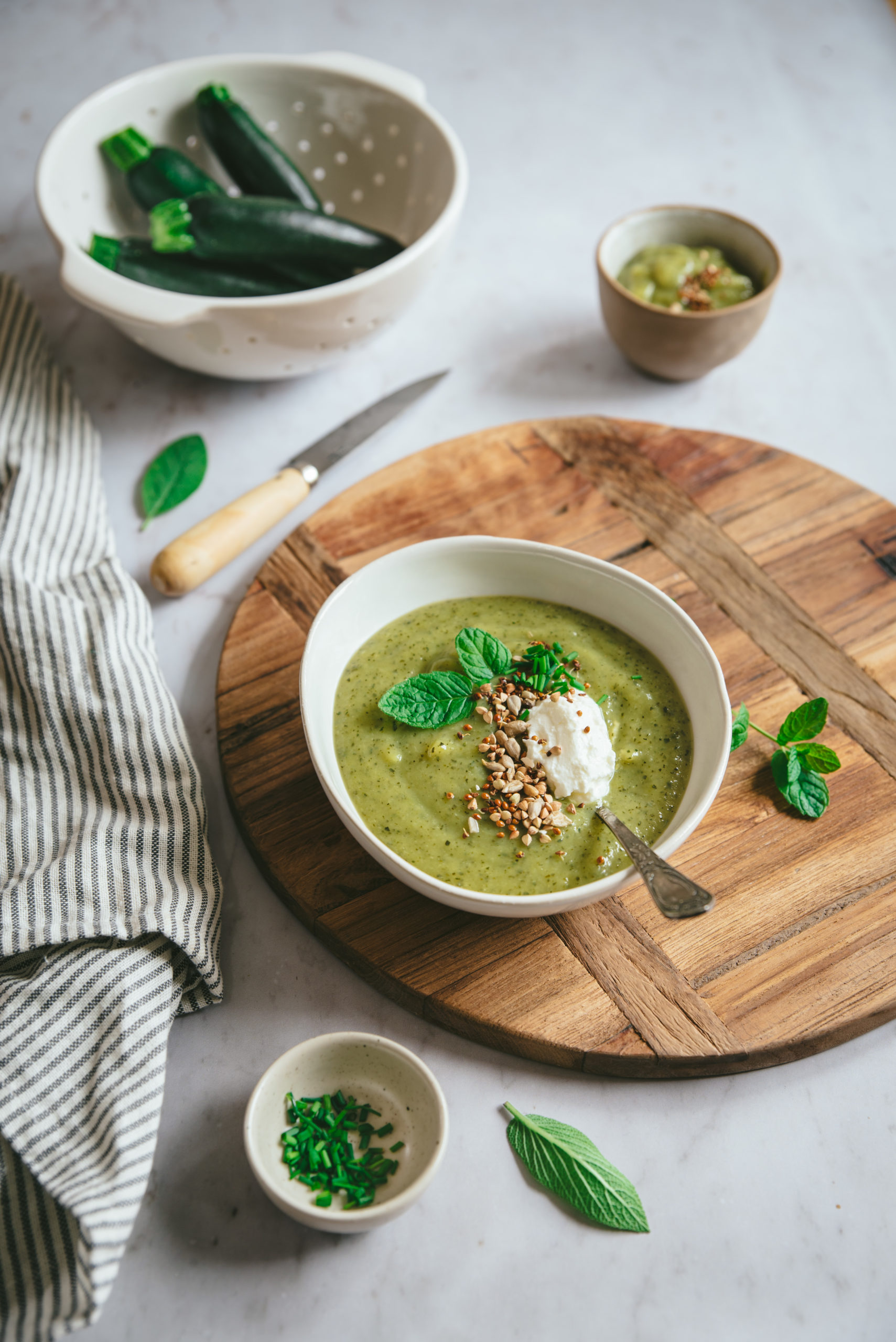 Creamy zucchini soup with fresh cheese and mint