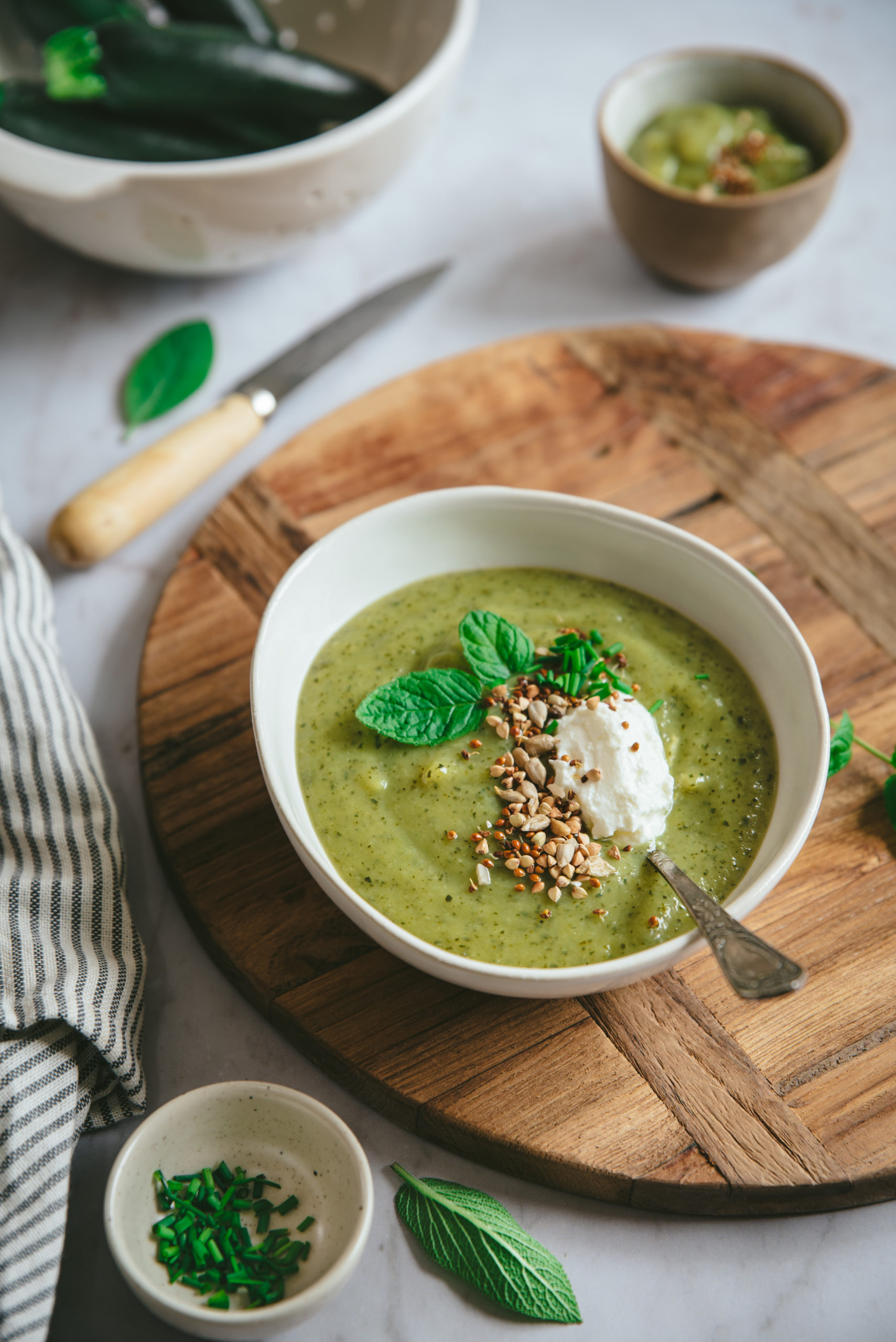 Creamy zucchini soup with fresh cheese and mint