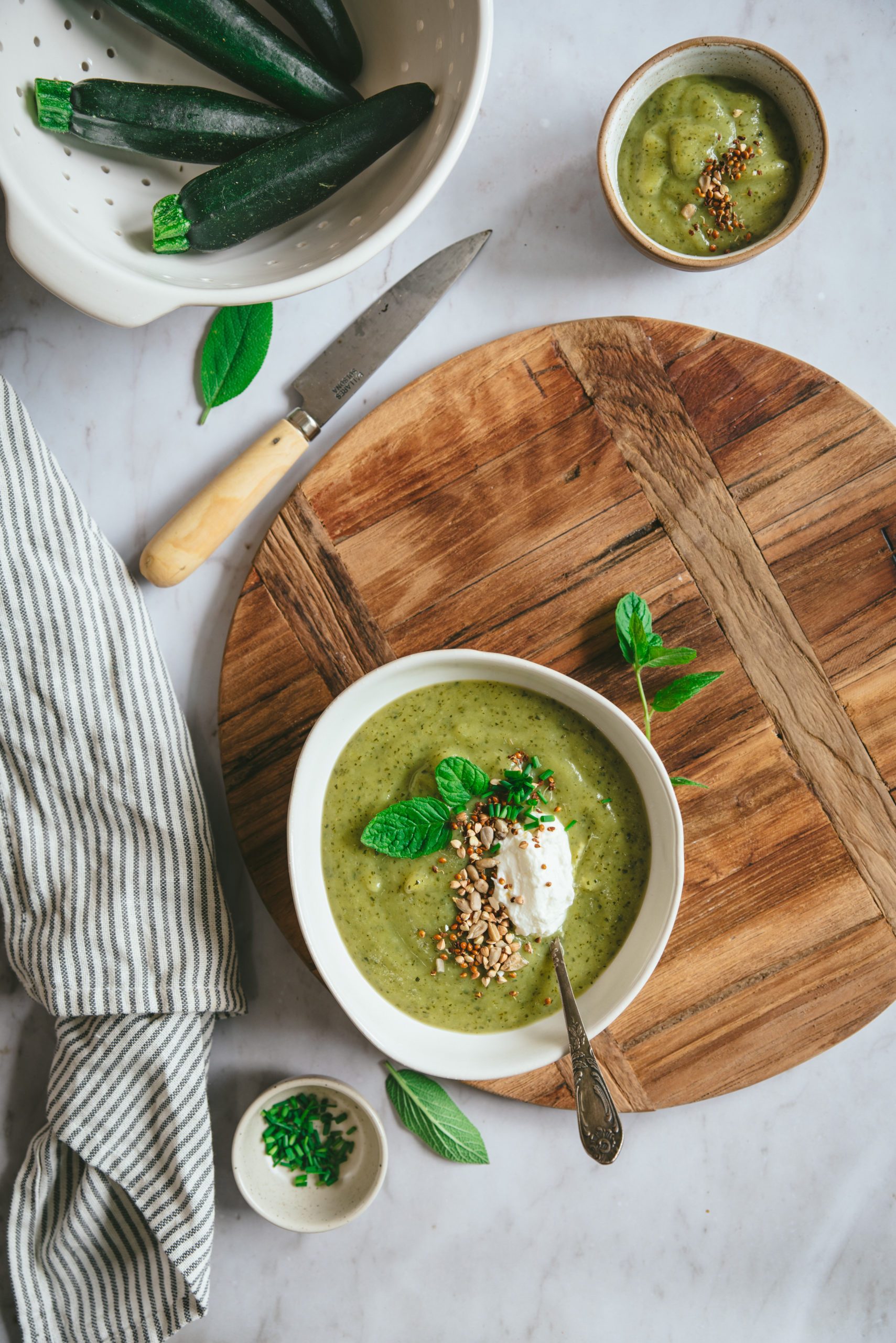 Creamy zucchini soup with fresh cheese and mint