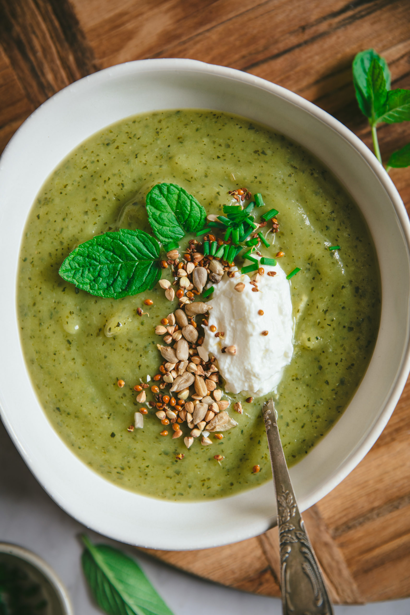 Creamy zucchini soup with fresh cheese and mint