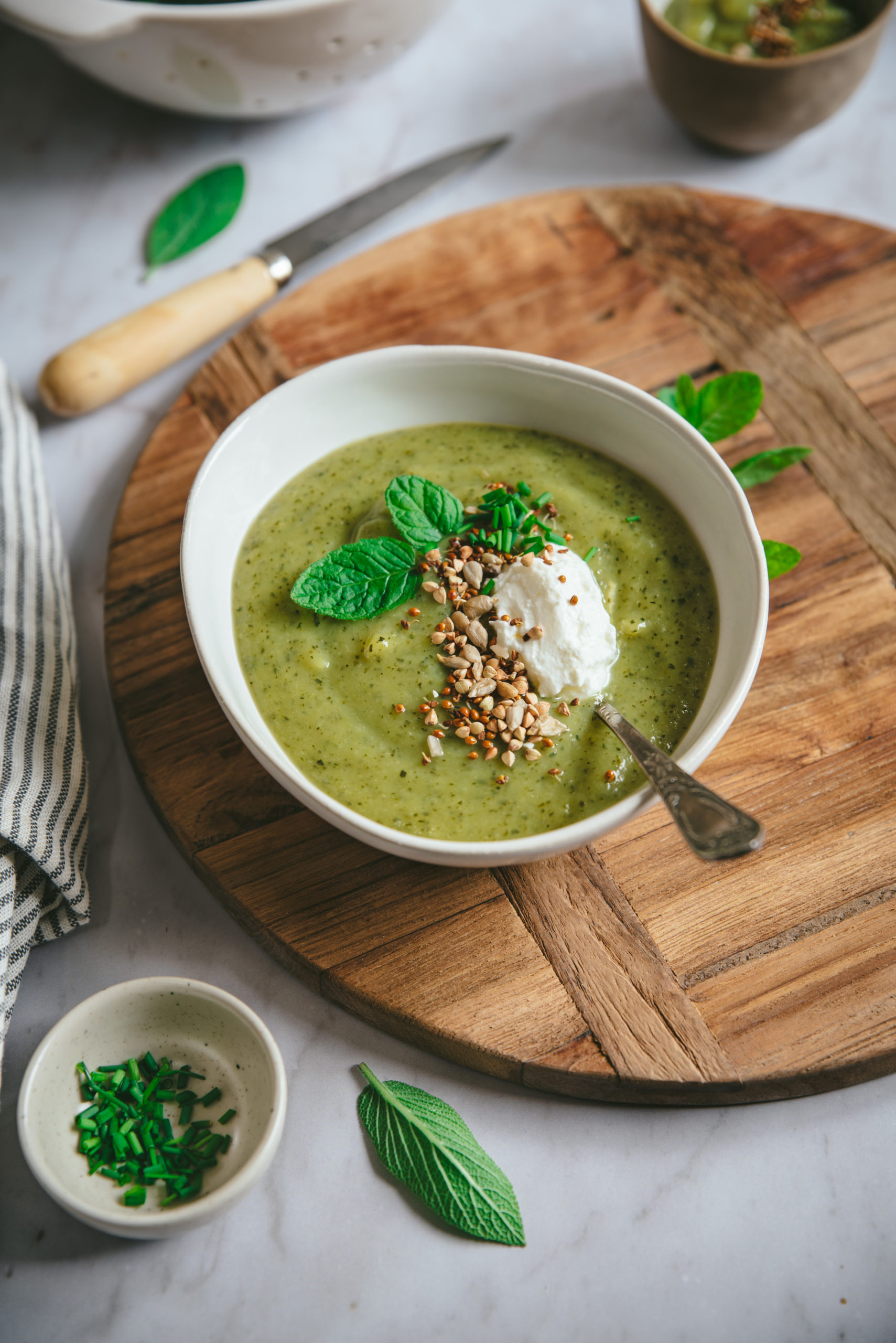 Creamy zucchini soup with fresh cheese and mint